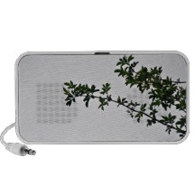 Small Green Leafy Branch against cloudy sky Travel Speaker