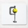 Smiley yellow head caught in a vice mouse mat
