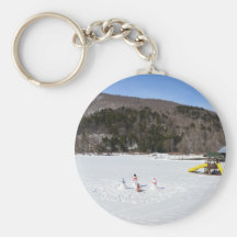 Snowmen in a field keychain