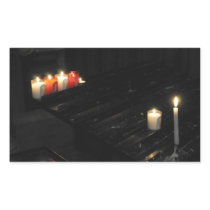 Some religious candles on a black support in a chu rectangular stickers