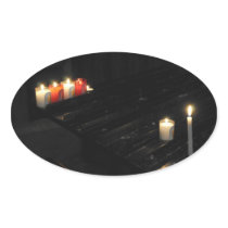 Some religious candles on a black support in a chu oval stickers
