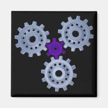 Some silver gears with a little purple fridge magnet