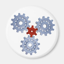 Some silver gears with a little red magnet