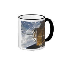 Space Shuttle Atlantis' payload bay backdropped Coffee Mugs