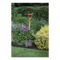 Spade in flower bed photographic print