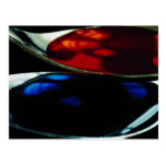 Spoons with blue and red liquid post card