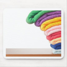 Stack of colourful microfiber towels toppling mouse pad