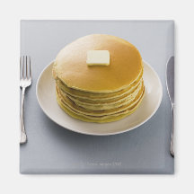 Stack of pancakes with butter on a plate fridge magnets