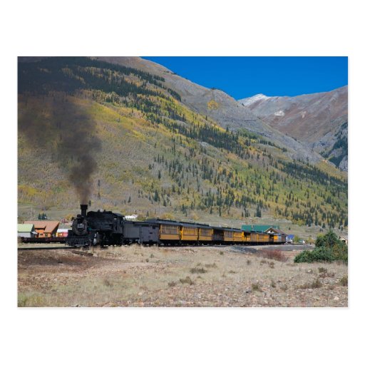 Steam train leaving town postcard
