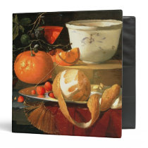 Still life of an orange binders