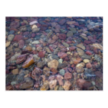 Stones in the lake at Glacier National Park Post Card