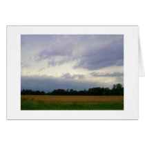 Stormy skies bad weather approaching farm fields
