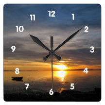 Stormy Sunset Wall Clocks