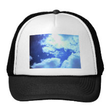 Sun lights up the clouds trucker hat