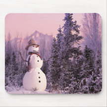Sunset Snowman in the Winter Mountains Mouse Pads