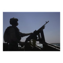 Technician manning an M240 machine gun in Iraq