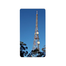 Telecommunications tower under a blue sky labels
