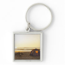 Tent and Burned out Campfire on the Beach. Keychains