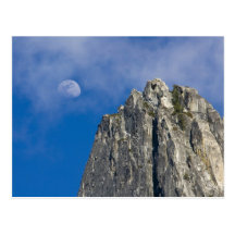 The moon rises and shines through the clouds postcards