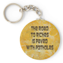 The Road to Riches is Paved with Potholes Keychain