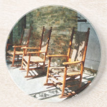 Three Wooden Rocking Chairs on Sunny Porch