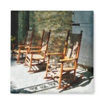 Three Wooden Rocking Chairs on Sunny Porch