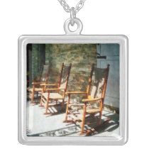 Three Wooden Rocking Chairs on Sunny Porch