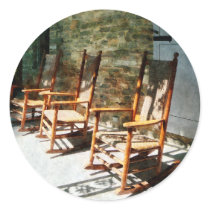 Three Wooden Rocking Chairs on Sunny Porch