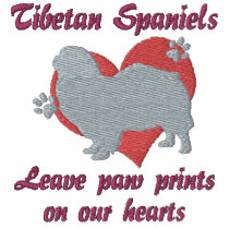 Tibetan Spaniels Leave Paw Prints
