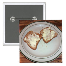 Toasted bread with butter in a plate buttons