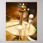 Traditional handcrafted brass orrery with the poster
