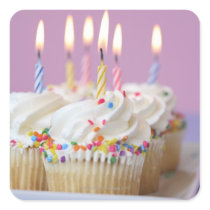 Tray of birthday cupcakes with candles sticker