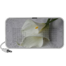 two calla lilies on linen speaker