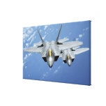 Two F-22 Raptors fly over the Pacific Ocean Stretched Canvas Print