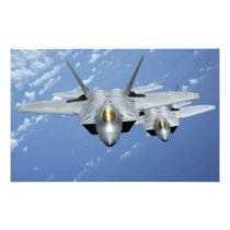 Two F-22 Raptors fly over the Pacific Ocean