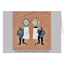 Two firemen holding the standards of the companies card