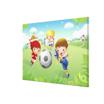 Two girls and a boy playing soccer stretched canvas print