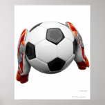 Two goal keepers gloves holding a football posters