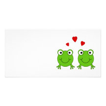 Two green frogs with red hearts. picture card