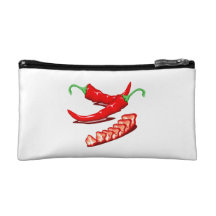 Two red chili peppers one cut up also makeup bags