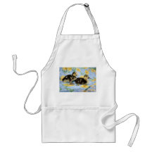 two rouen ducklings facing right one standing apron