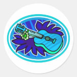 Ukulele with leaves and flowers circle, blue round sticker