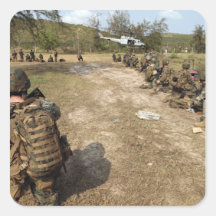 US Marines provide security as a UH-1N Stickers
