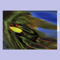 USA, Michigan, Birch leaf in river with autumn cards