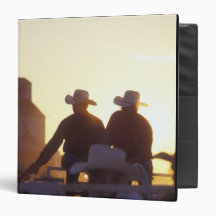 USA, Wyoming, Pine Bluffs. Two men shake Vinyl Binders