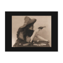 Vintage cowgirl with gun postcard