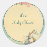 Vintage Stork Carrying Baby Boy in Blue Blanket Round Sticker