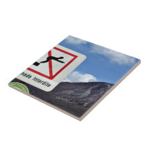 Waterscape with warning sign against the mountain tiles