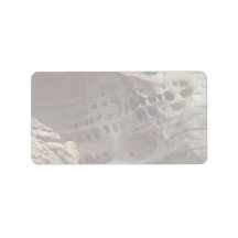 Weathered holes in sandstone address label