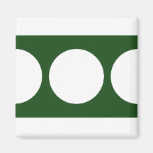 White Circles on Green Refrigerator Magnets